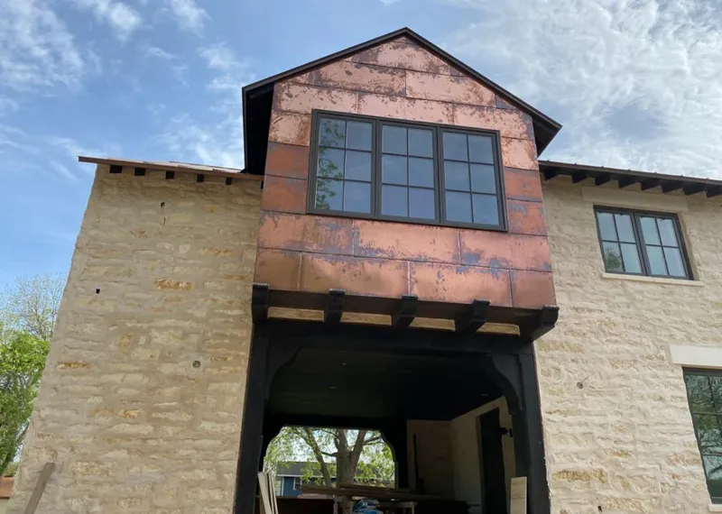 Copper metal panel facade on a stone building for Metal Roof Coating in Avocado Heights